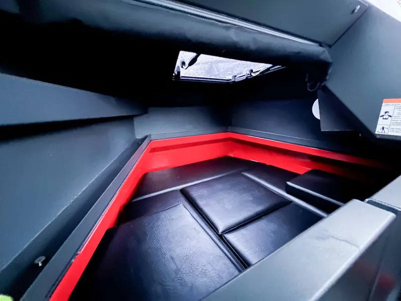Slide: The Image of Interior cabin of 2024 Stabicraft 2250 Alpha Ultra Centrecab with black and red accents. - 12