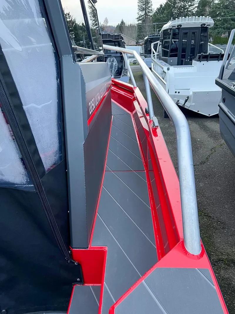 Slide: The Image of 2024 Stabicraft 2250 Alpha Ultra Centrecab, side view of the deck and railing. - 22