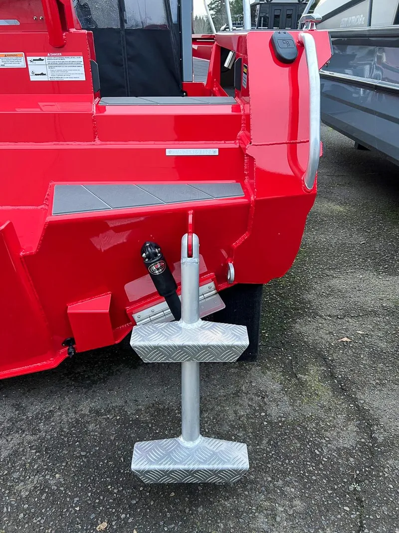 Slide: The Image of 2024 Stabicraft 2250 Alpha Ultra Centrecab, red exterior, rear view with boarding ladder. - 24