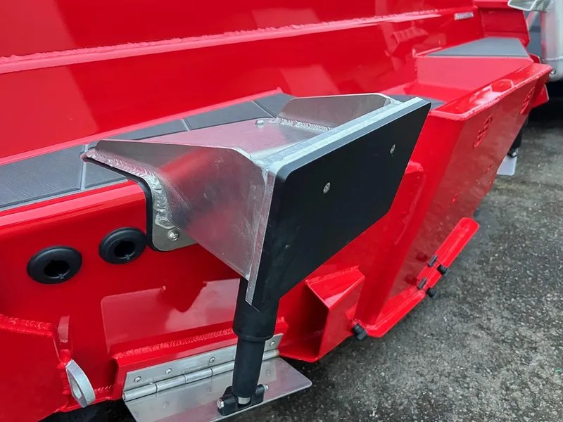 Slide: The Image of Close-up of the 2024 Stabicraft 2250 Alpha Ultra Centrecab's red hull and transom. - 26