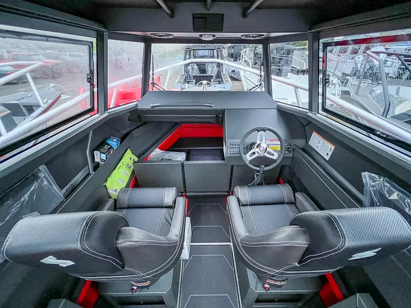 Slide: The Image of Interior of 2024 Stabicraft 2250 Alpha Ultra Centrecab boat with modern helm and seating. - 7