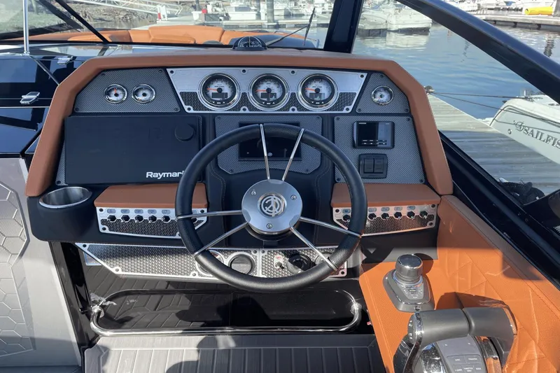 Slide: The Image of 2021 Cruisers Yachts 338 CX helm with Raymarine electronics and modern controls. - 10