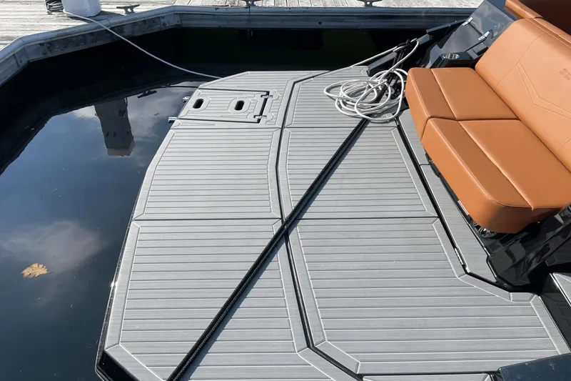 Slide: The Image of 2021 Cruisers Yachts 338 CX swim platform and seating area at dock. - 6