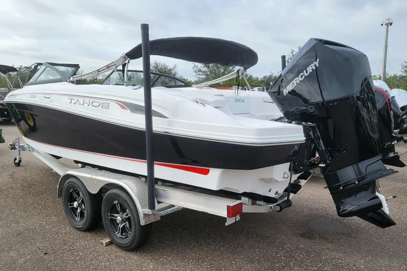 Slide: The Image of 2024 Tahoe 210 S boat on trailer with Mercury outboard motor. - 5
