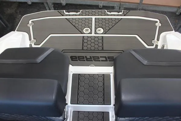 Slide: The Image of 2023 Scarab 255 ID boat deck with black and white hexagonal pattern. - 11