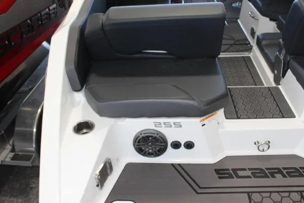 Slide: The Image of 2023 Scarab 255 ID boat interior with seating and speaker system. - 12