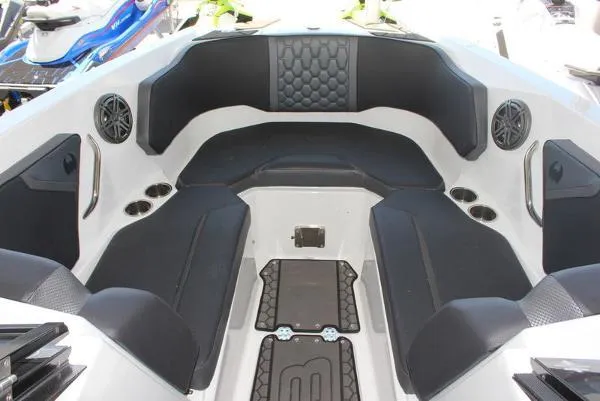 Slide: The Image of 2023 Scarab 255 ID boat interior with black seating and modern design. - 4