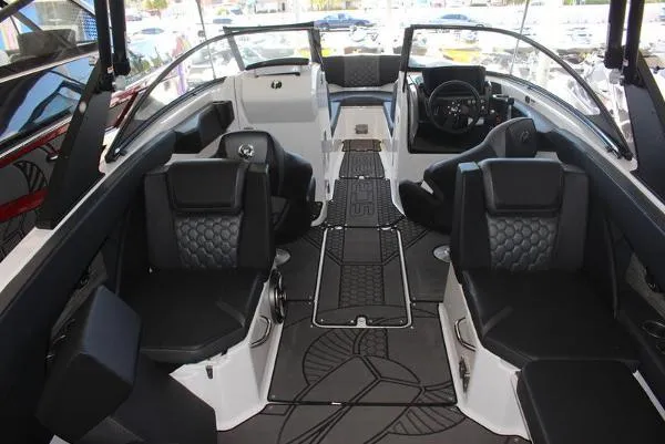 Slide: The Image of 2023 Scarab 255 ID boat interior with black seating and modern dashboard. - 5