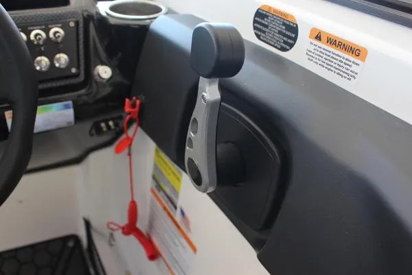 Slide: The Image of 2023 Scarab 255 ID boat throttle control and dashboard. - 8
