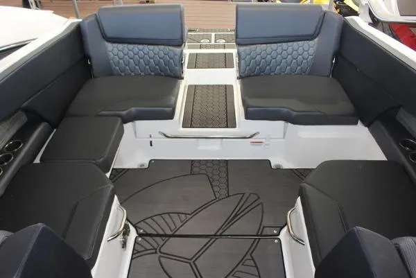 Slide: The Image of 2023 Scarab 255 ID boat interior with black and gray seating and patterned flooring. - 9