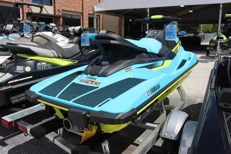 Slide: The Image of 2023 Yamaha WaveRunner EX Deluxe in blue and yellow on a trailer. - 3