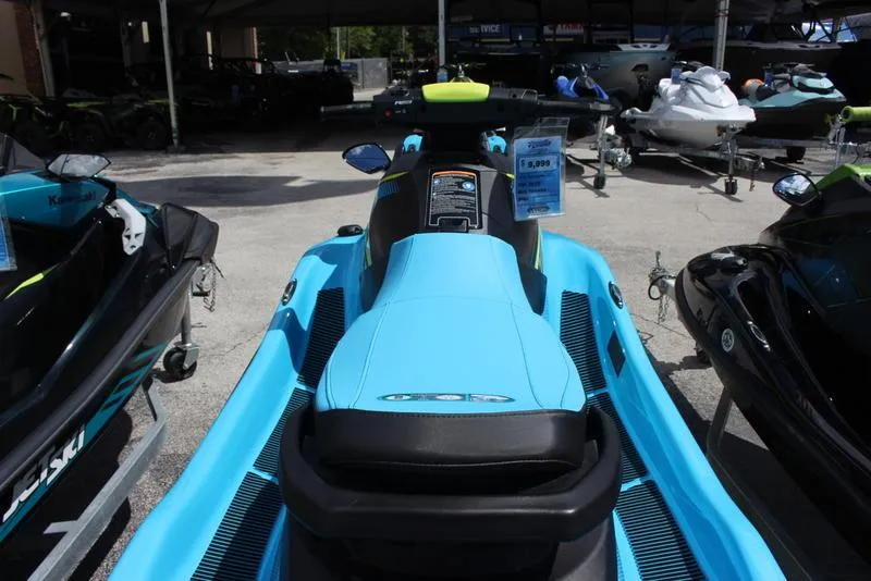 Slide: The Image of 2023 Yamaha WaveRunner EX Deluxe in blue on display at a dealership. - 4