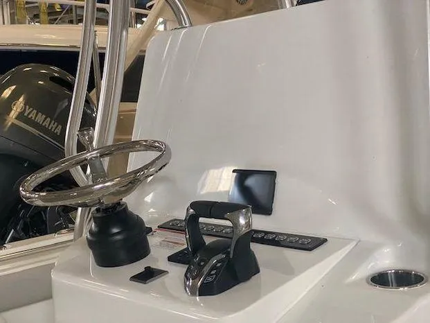 Slide: The Image of 2024 Contender 24 Sportfish boat helm with Yamaha engine controls. - 10