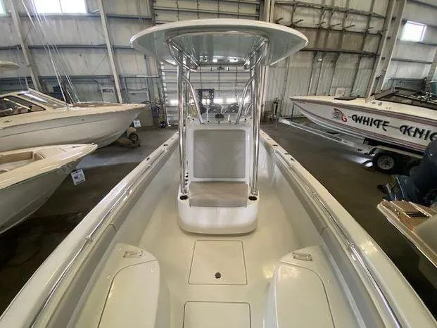 Slide: The Image of 2024 Contender 24 Sportfish boat in showroom, center console view. - 8