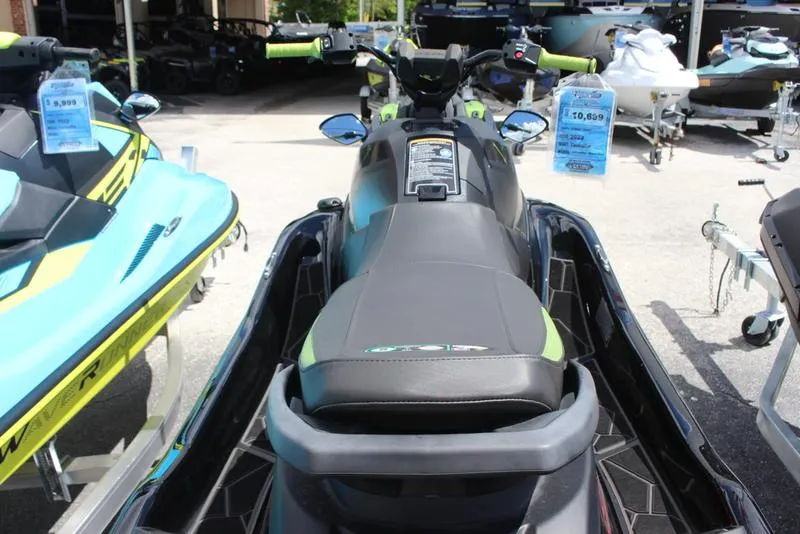 Slide: The Image of 2023 Yamaha WaveRunner JetBlaster, black and green, displayed in a showroom. - 4