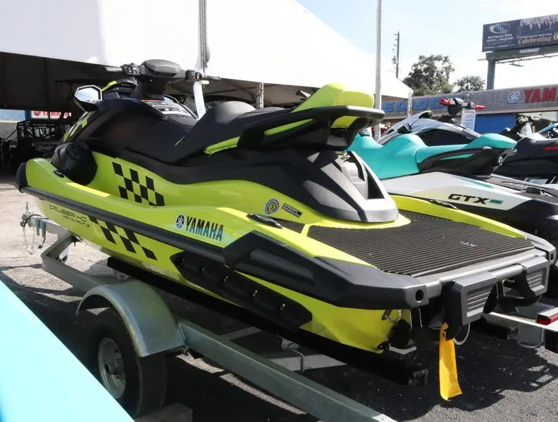 Slide: The Image of 2023 Yamaha WaveRunner VX Cruiser HO on a trailer, displayed at a dealership. - 2