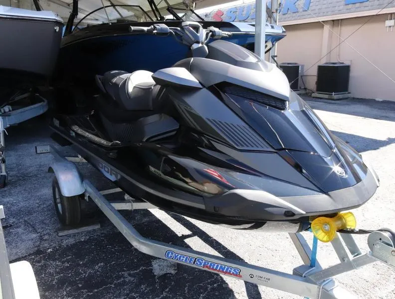 Slide: The Image of 2023 Yamaha WaveRunner GP1800R HO on trailer, black and sleek design. - 1