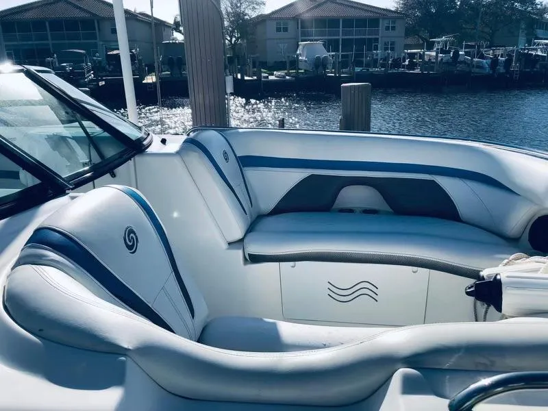 Slide: The Image of 2019 Godfrey Hurricane SD2200 boat interior with white and blue seating. - 2