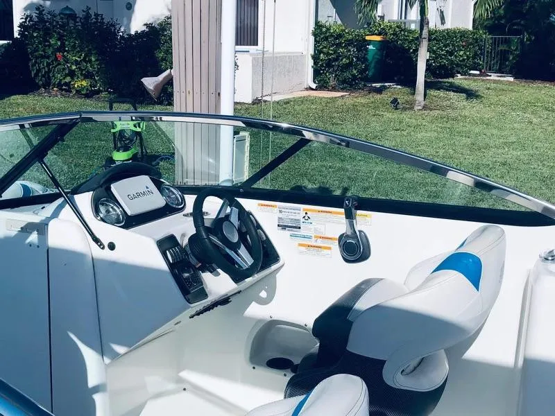 Slide: The Image of 2019 Godfrey Hurricane SD2200 boat interior with steering wheel and seating. - 4
