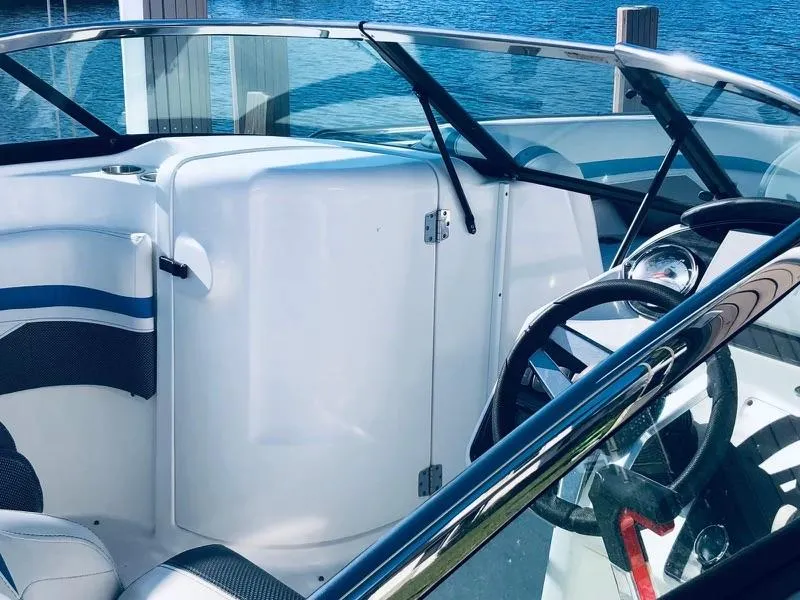 Slide: The Image of 2019 Godfrey Hurricane SD2200 boat interior with steering wheel and seating. - 6
