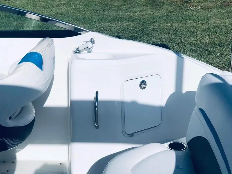 Slide: The Image of 2019 Godfrey Hurricane SD2200 boat interior with seating and storage compartment. - 8