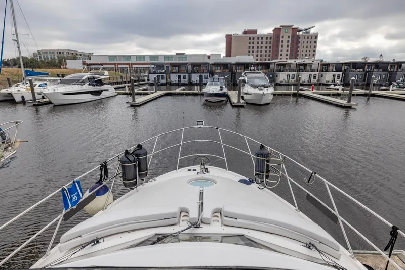 Slide: The Image of Bow view of 2004 Meridian 459 Motoryacht docked in a marina. - 10