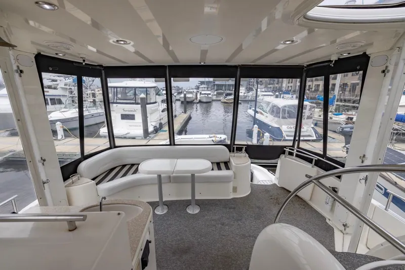 Slide: The Image of Spacious interior of 2004 Meridian 459 Motoryacht with marina view. - 13