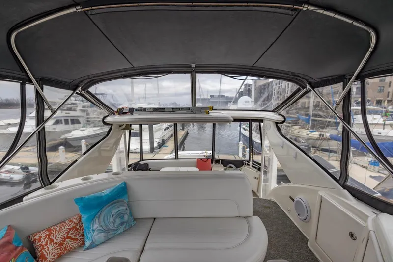 Slide: The Image of Interior view of 2004 Meridian 459 Motoryacht with marina backdrop. - 16