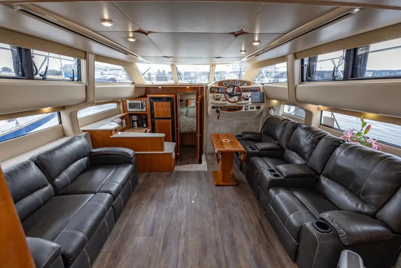 Slide: The Image of Luxurious interior of 2004 Meridian 459 Motoryacht with leather seating and wood accents. - 20