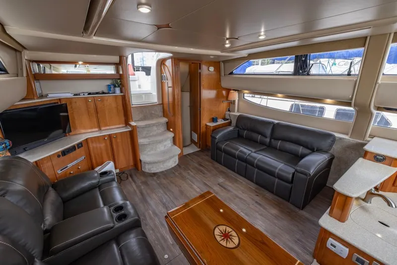 Slide: The Image of Luxurious interior of 2004 Meridian 459 Motoryacht with leather seating and wooden accents. - 22