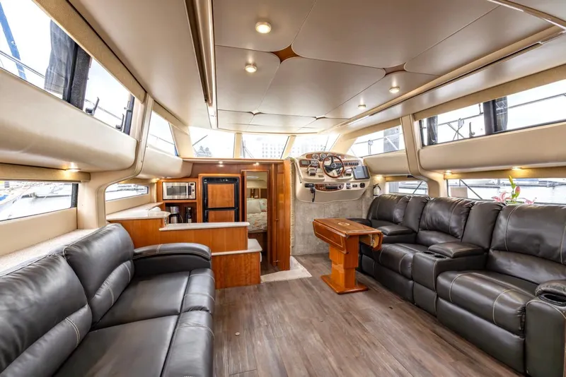 Slide: The Image of Luxurious interior of a 2004 Meridian 459 Motoryacht with leather seating and modern amenities. - 23