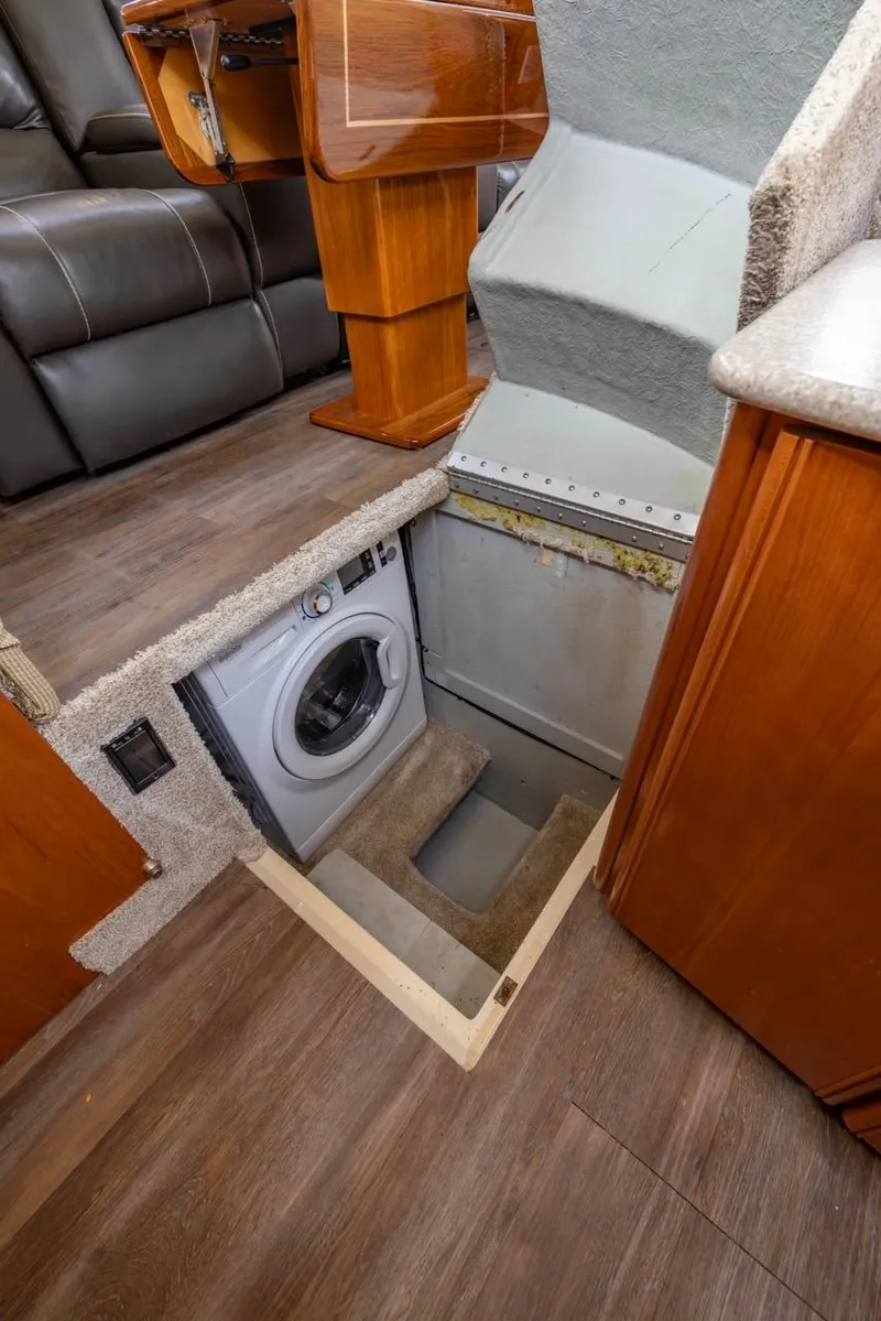 Slide: The Image of 2004 Meridian 459 Motoryacht interior with hidden washing machine compartment. - 28