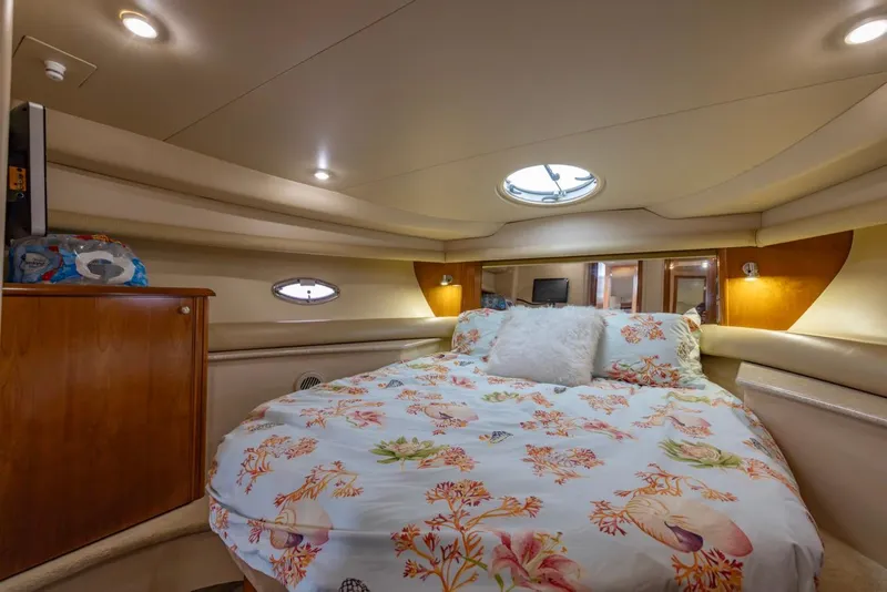 Slide: The Image of Luxurious bedroom interior of 2004 Meridian 459 Motoryacht with floral bedding and ambient lighting. - 35