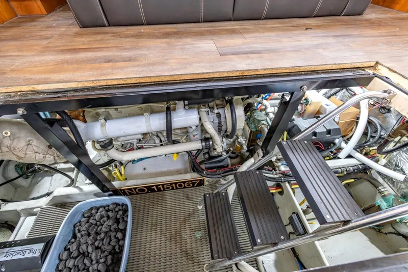 Slide: The Image of Engine room of 2004 Meridian 459 Motoryacht with visible machinery and access ladder. - 43