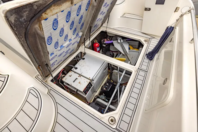 Slide: The Image of 2004 Meridian 459 Motoryacht engine compartment with open hatches and visible equipment. - 6