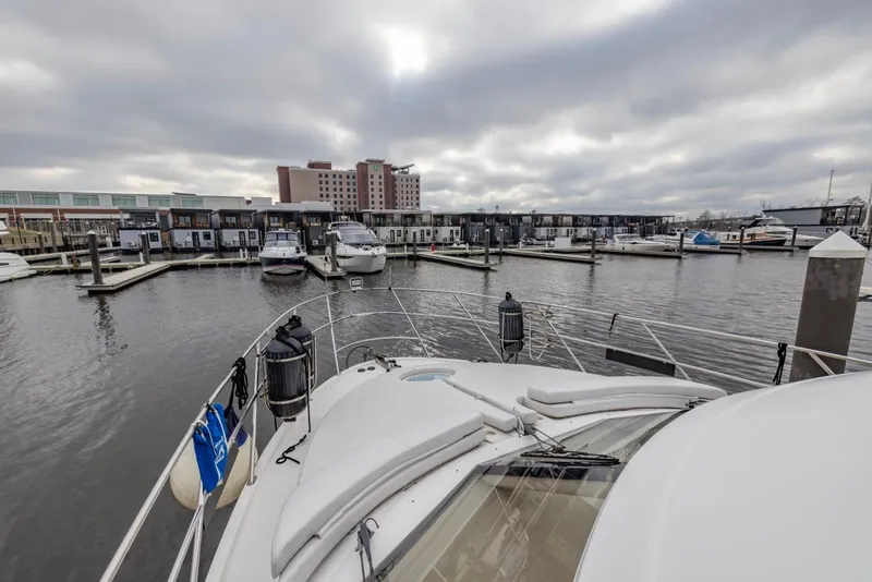 Slide: The Image of 2004 Meridian 459 Motoryacht docked in a marina under cloudy skies. - 8