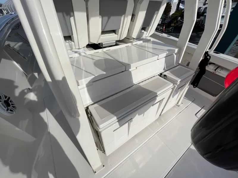 Slide: The Image of 2022 Pursuit S 358 boat interior with sleek seating and storage compartments. - 10