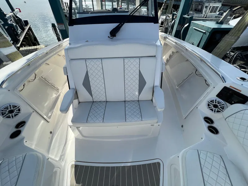 Slide: The Image of 2022 Pursuit S 358 boat interior with white seating and modern design. - 14