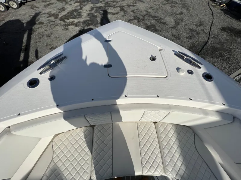 Slide: The Image of 2022 Pursuit S 358 boat bow with quilted seating and deck hatch. - 17