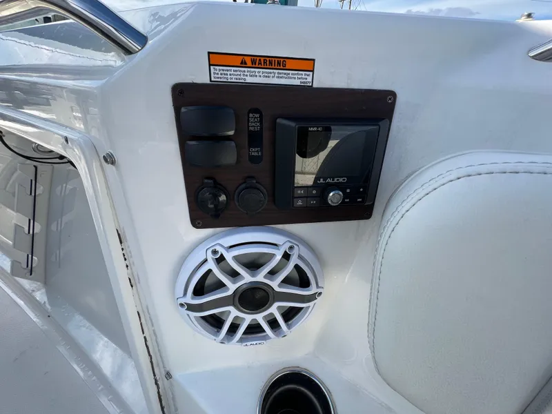 Slide: The Image of Control panel and speaker on 2022 Pursuit S 358 boat. - 19