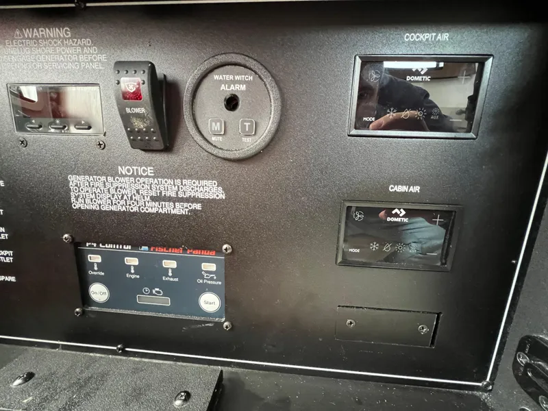 Slide: The Image of Control panel of a 2022 Pursuit S 358 boat, featuring cockpit and cabin air controls. - 29