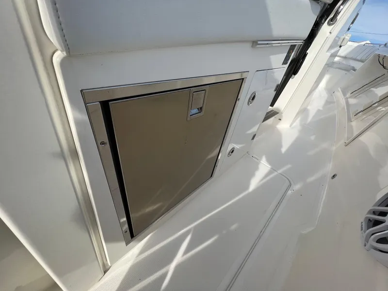 Slide: The Image of 2022 Pursuit S 358 boat interior with sleek storage compartment. - 40