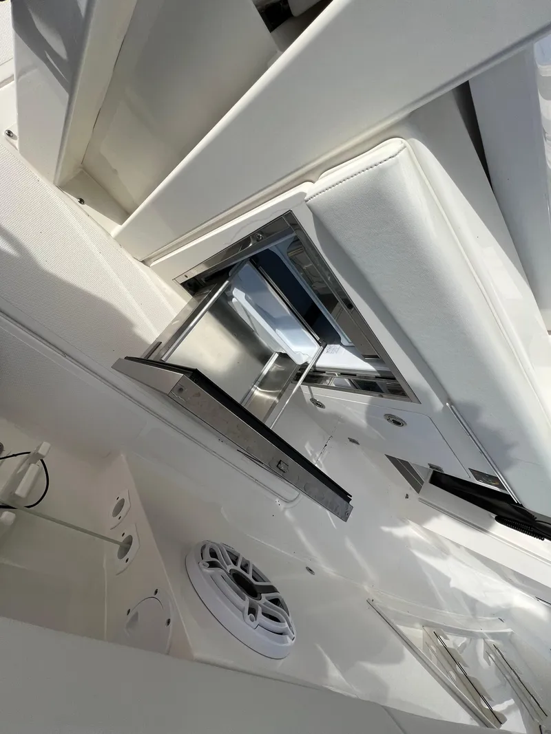 Slide: The Image of 2022 Pursuit S 358 boat interior with sleek white seating and modern design. - 41