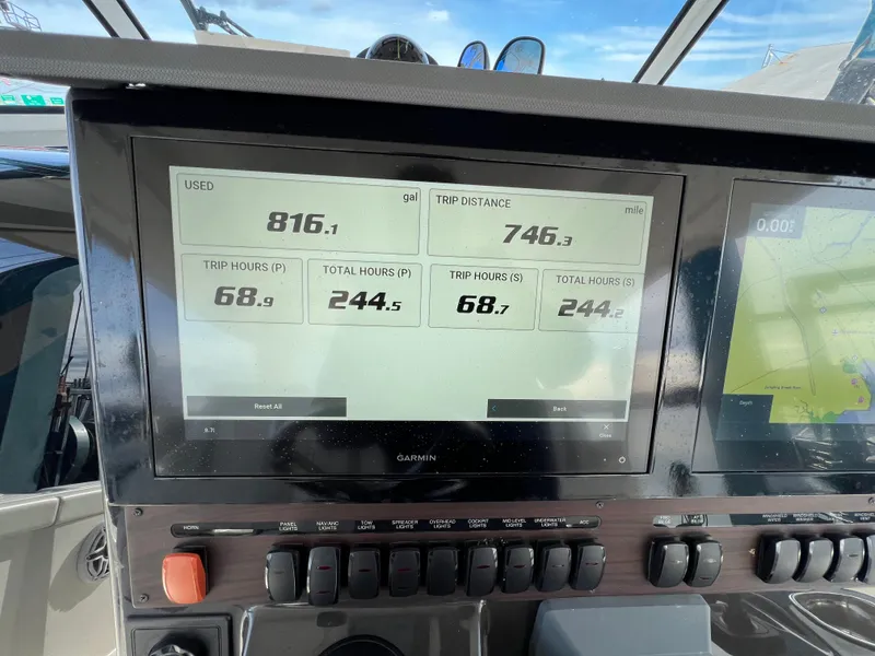 Slide: The Image of Boat dashboard display showing trip data on a 2022 Pursuit S 358. - 44