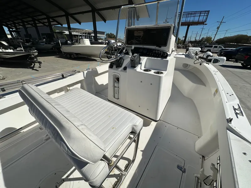 Slide: The Image of 2000 Boston Whaler Outrage 18 boat interior with steering console and seating. - 8