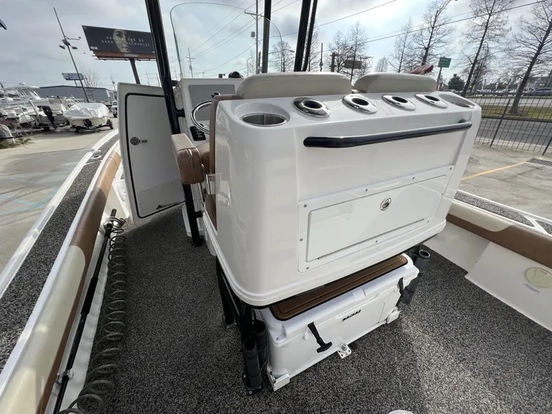 Slide: The Image of 2021 Caymas 26 HB boat interior with console and seating, showcasing modern design and functionality. - 13