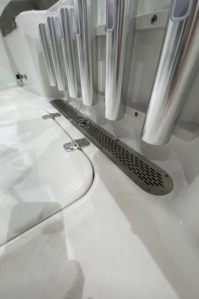 Slide: The Image of 2024 Sea Pro 202 boat deck with rod holders and drainage system. - 10