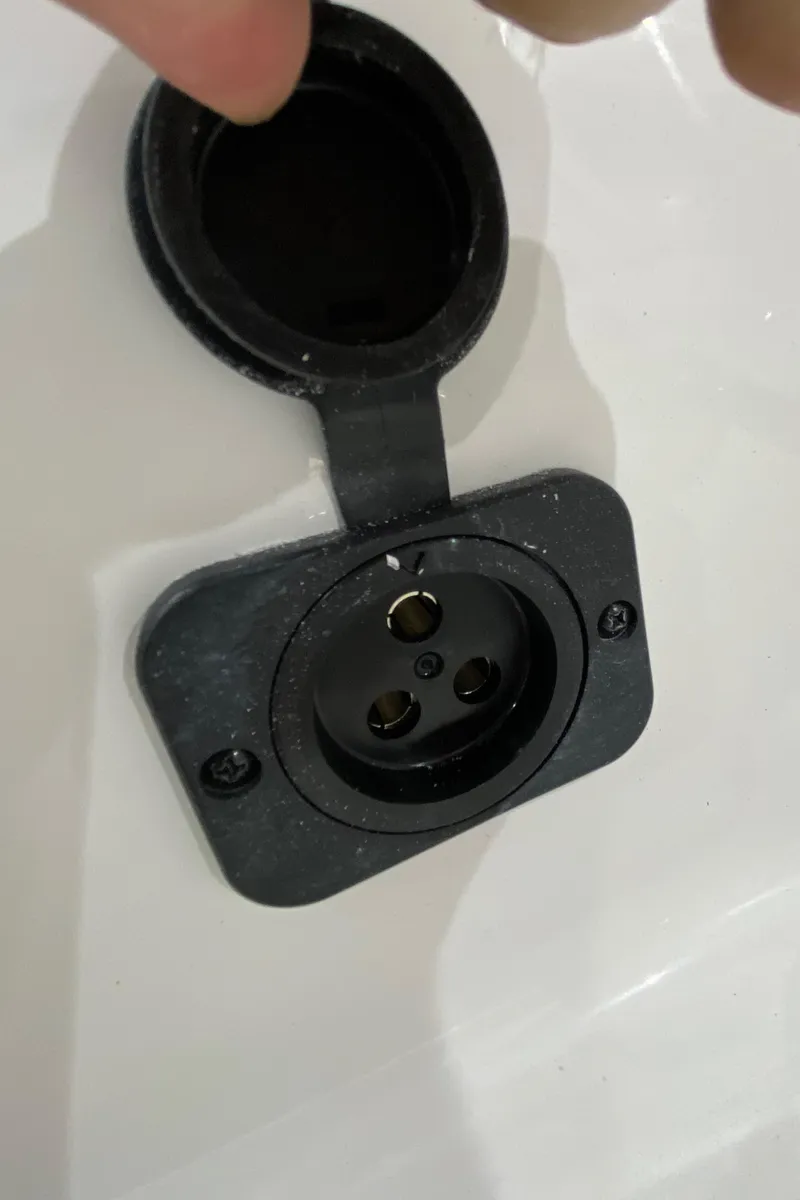 Slide: The Image of 2024 Sea Pro 202 boat power socket with protective cover. - 13