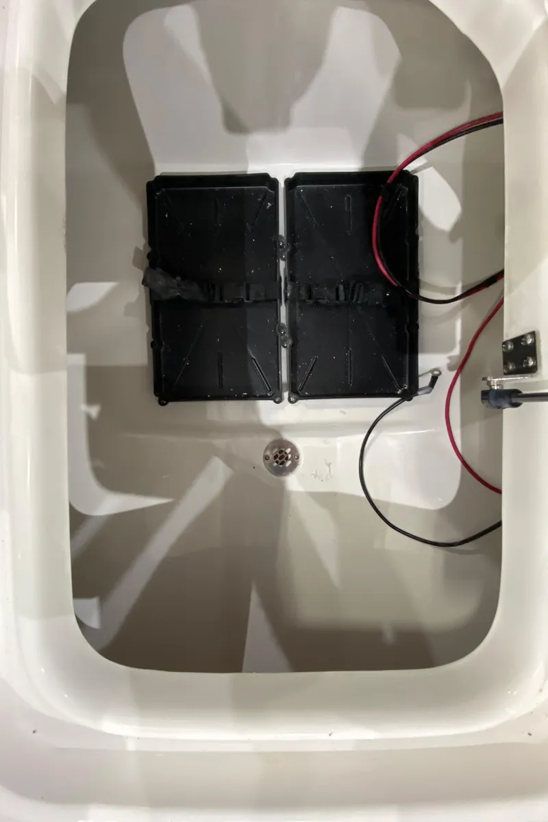 Slide: The Image of 2024 Sea Pro 202 boat battery compartment with wiring. - 14
