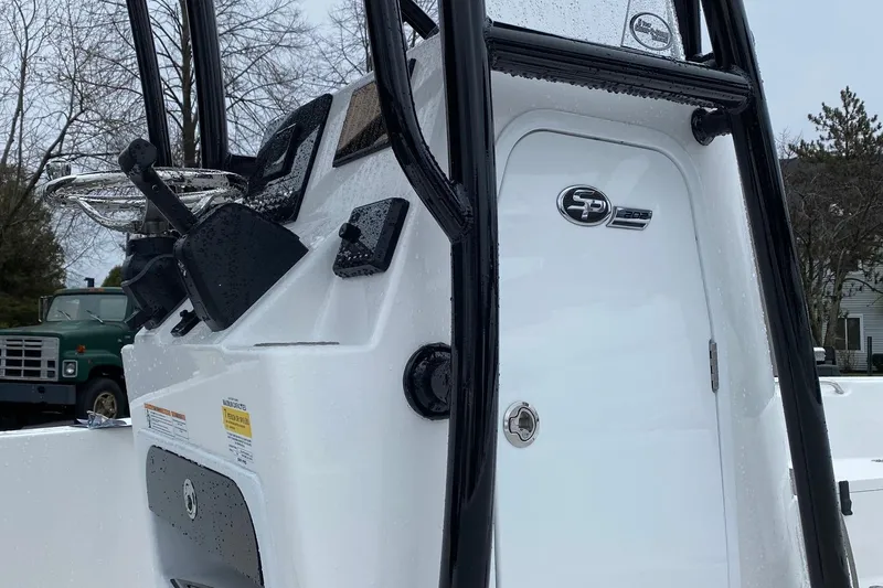 Slide: The Image of 2024 Sea Pro 202 boat console with steering wheel and controls. - 17